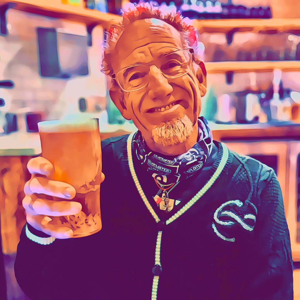 Dave the Punk with pink hair and a pint, celebrating his 60th