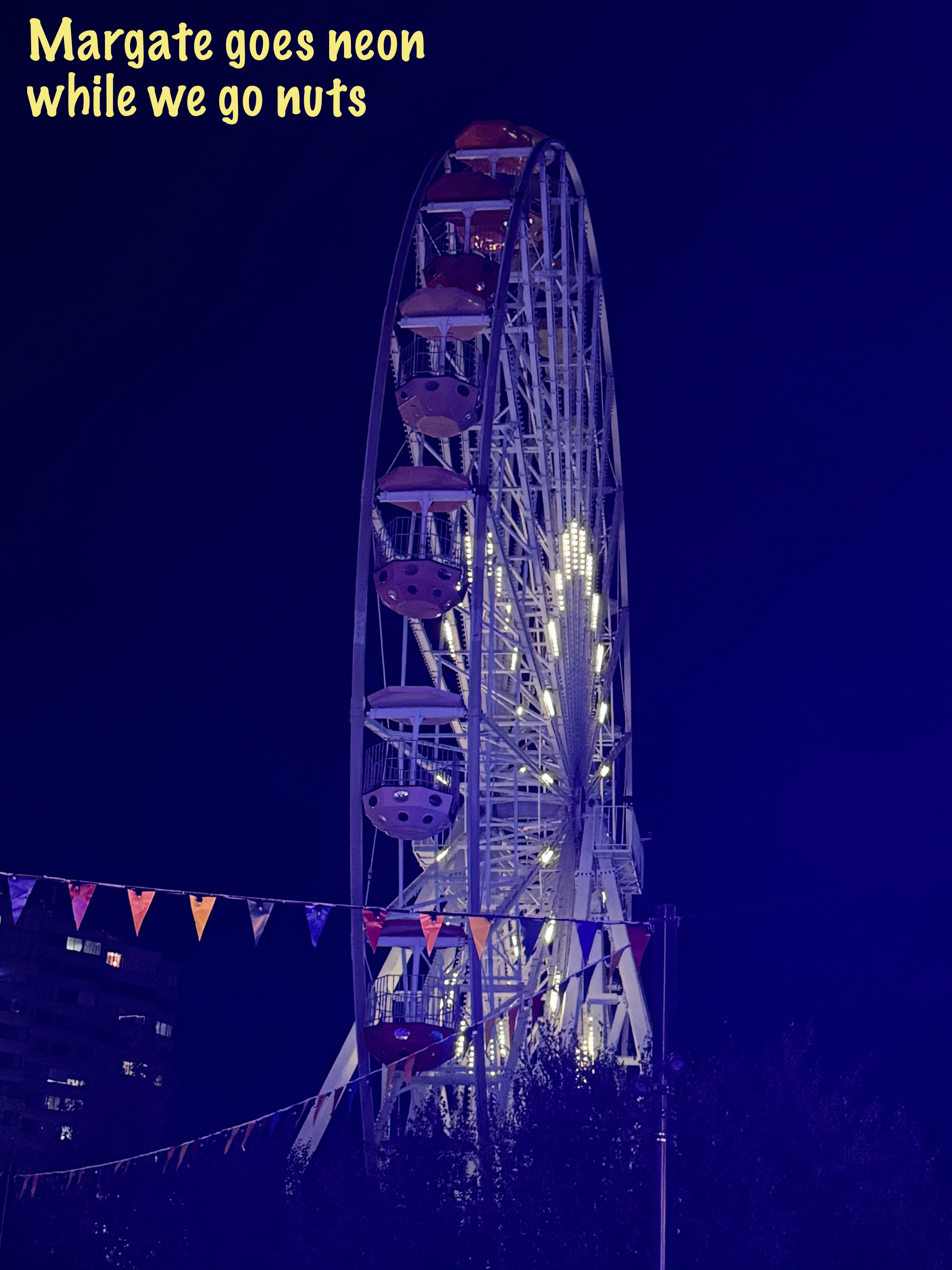 Margate seafront ferris wheel lit up at night during the gig